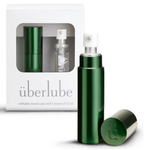 Green travel size lubricant 15ml glass vial and aluminum travel case with packaging labeled 'uberlube' on a white background — 22
