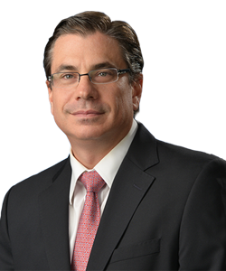 Man with glasses in a suit. Dr. Michael Krychman